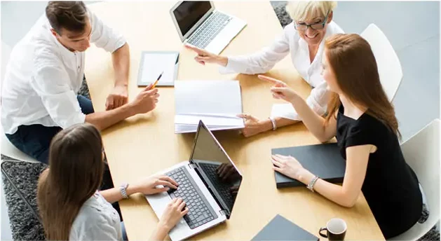 Crafting Workplace Culture Through Communication: A Positive Workplace Imperative 6 Diverse team communicating around conference table