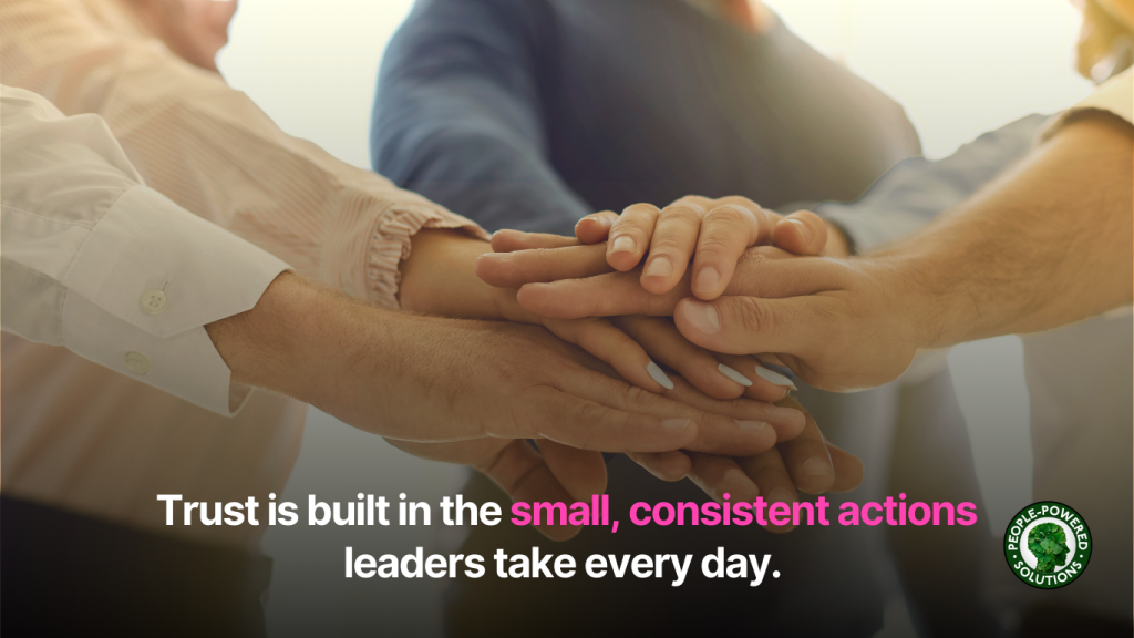 5 Everyday Ways to Build Trust as a Leader 1 Hands in a huddle with the text 'trust is built in the small, consistent actions leaders take every day'